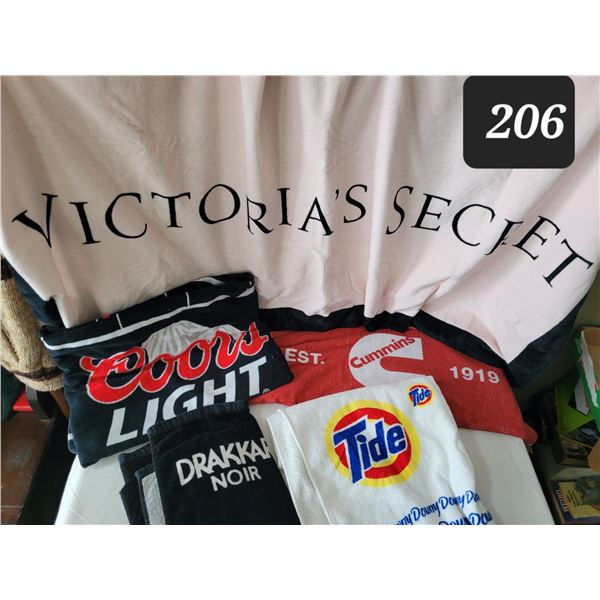 Advertising towels including Cummins, Coors & Victoria Secret.