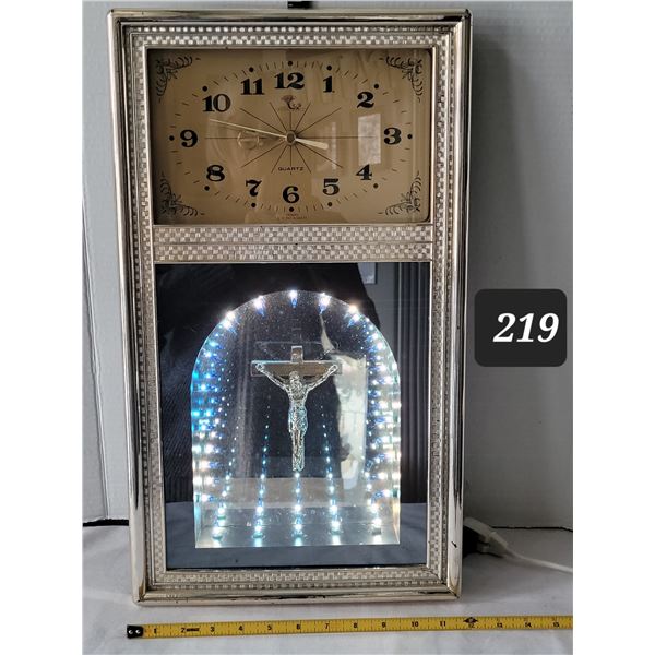 Lighted crucifix wall clock. Made in Taiwan.