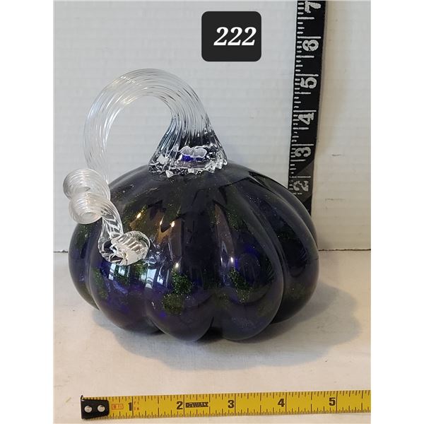 Hand blown art glass pumpkin. Deep blue color with green glitter accents.
