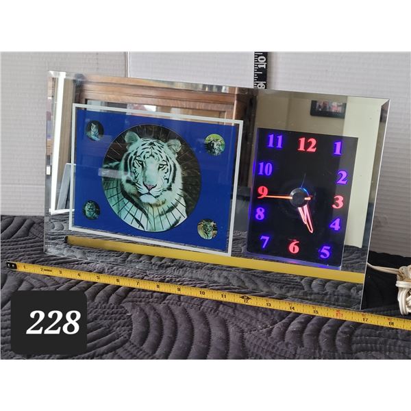Vtg. Tiger motion clock on mirror frame. Working clock, motion needs repair.