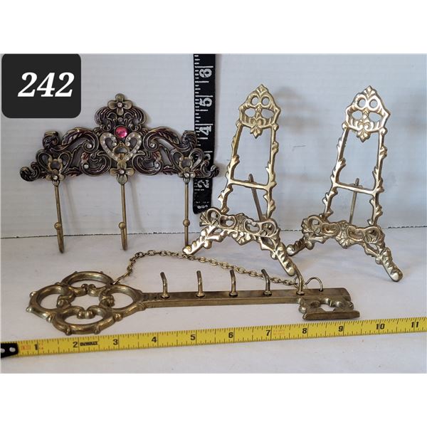 Ornate brass plate stands, key rack & wall hooks.