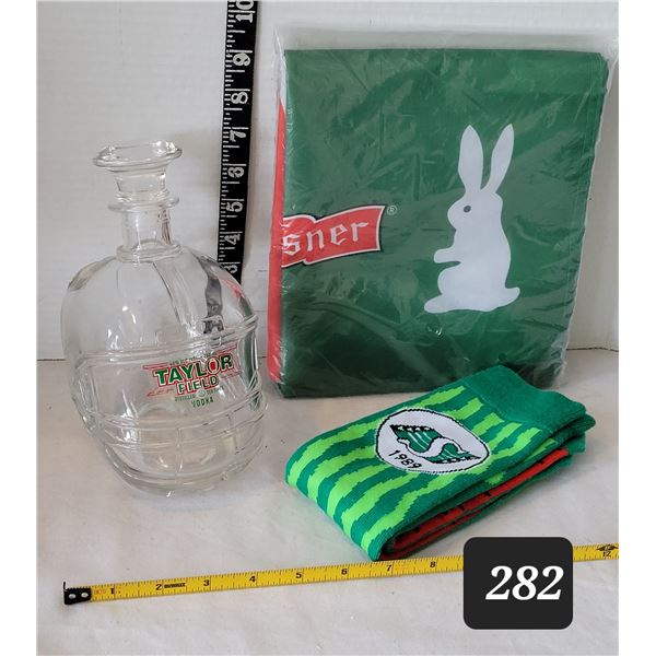 Sask. Roughrider, Taylor Field helmet vodka bottle, Pilsner flag & Roughrider watermelon socks.