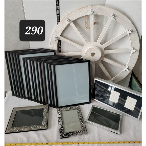 Assorted picture frames & wagon wheel with clips for photos.