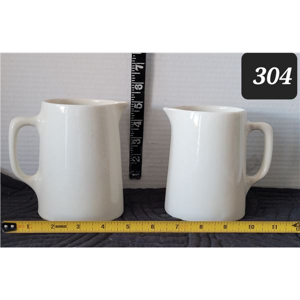 Early mid century Medicine Hat Potteries, ceramic pitchers. Small chip on one spout.