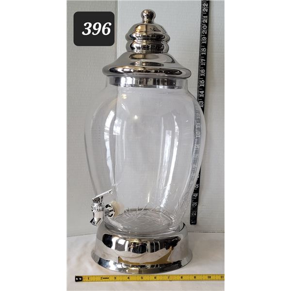 Large glass beverage dispenser. Heavy metal base and lid.