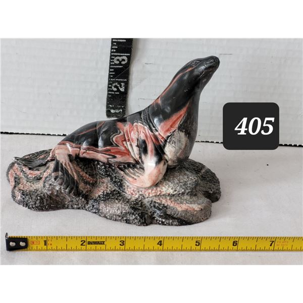 Thorn Arts sea lion sculpture made from an unusual swirled stone material. Canada.