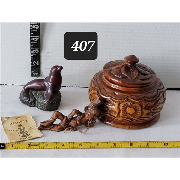 Arts from Canada (seal), Hawaii (good luck menehune), Haiti (carved wood bowl).