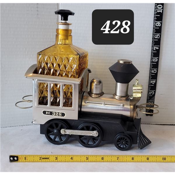 Mid century musical train liquor decanter. Plays when bottle is lifted. No glasses.