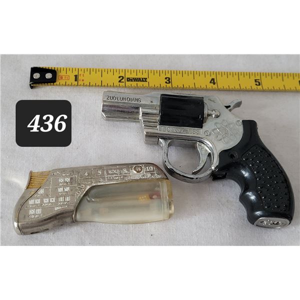 Novelty butane cigarette lighters. Vegas floating dice & hand gun.