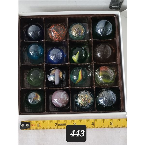 16 large 1” & smaller marbles.