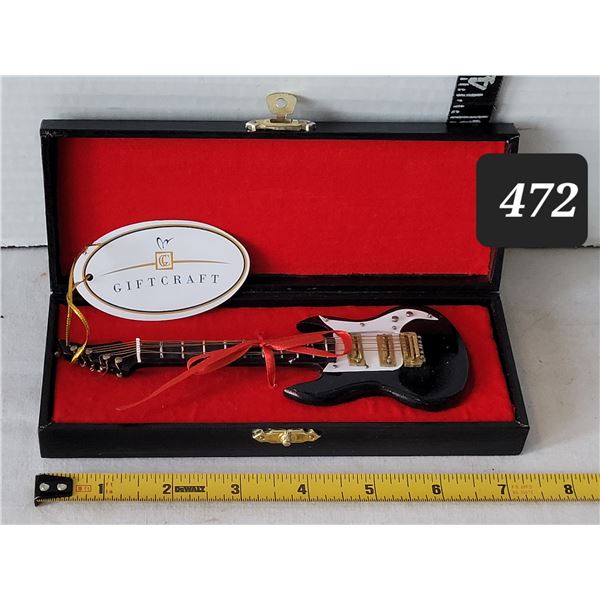 Collector Giftcraft miniature guitar in black case.
