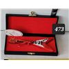 Image 1 : Collector Giftcraft miniature guitar in black case.