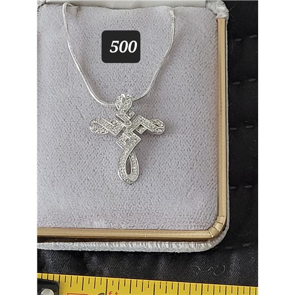 .925 silver fancy cross on 22” snake chain.