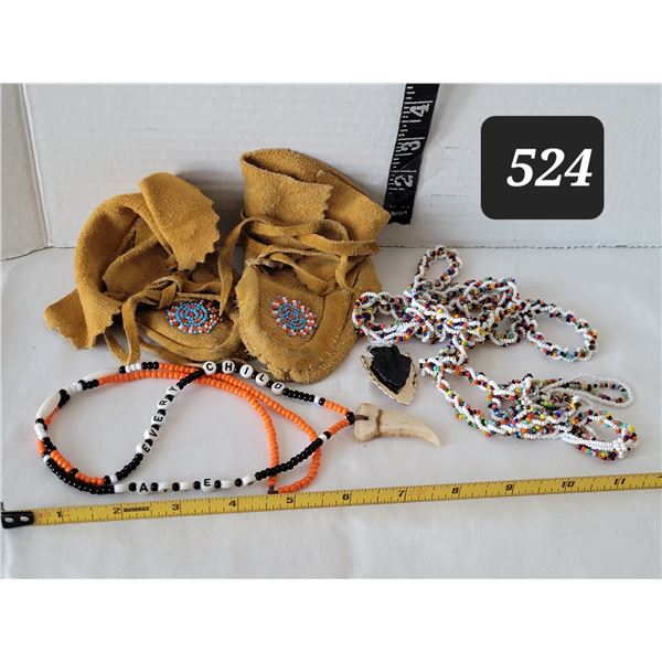 Soft tanned leather child moccasins. Bead work & arrow bolo tie.