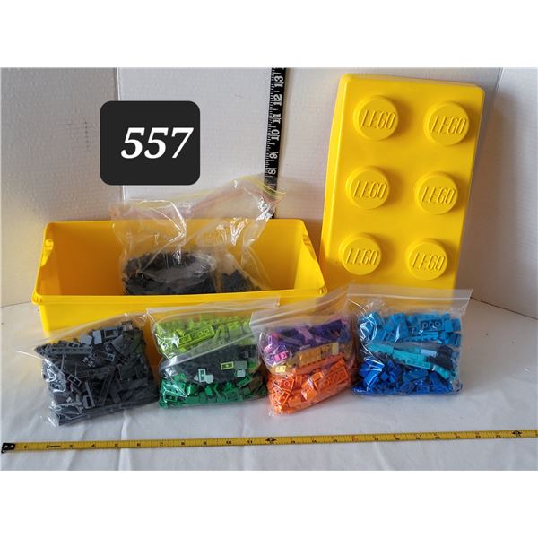 Lego storage brick containing bags of coloured lego bricks.