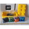 Image 1 : Lego storage brick containing bags of coloured lego bricks.
