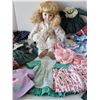Image 3 : Vintage porcelain doll with many clothes.