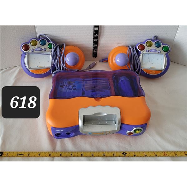 V-Tech game system, games, microphone & player controls.
