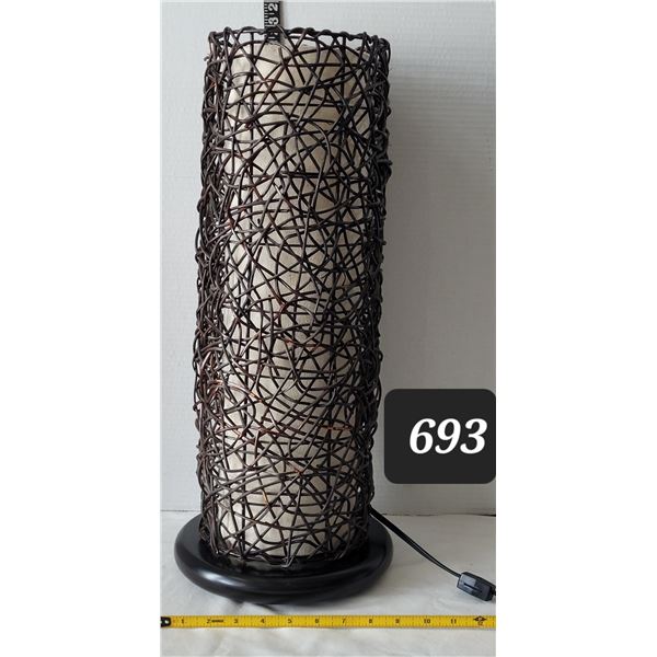 Wicker room lamp. Switch on the cord, wood base. Approx. 23” high.