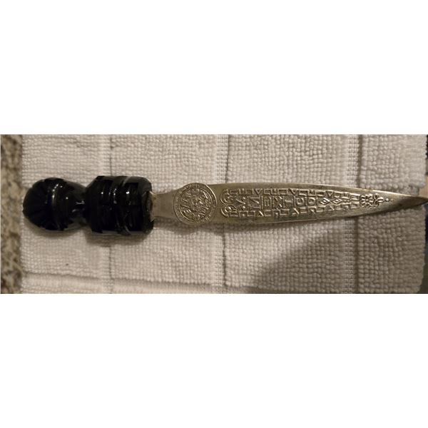 Decorative letter opener made in Mexico. Handle is carved black onyx and alpaca silver blade which i