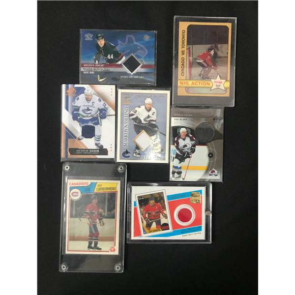 LOT OF 7 HOCKEY TRADING CARDS INCLUDING SEVERAL PATCH CARDS