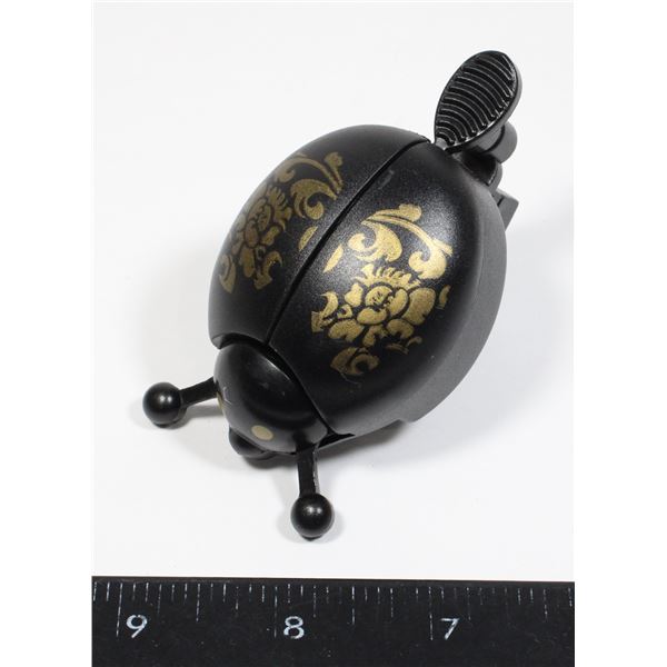 NEW LADY BUG BELL. TAB FLICKS THE BELL TO WORK