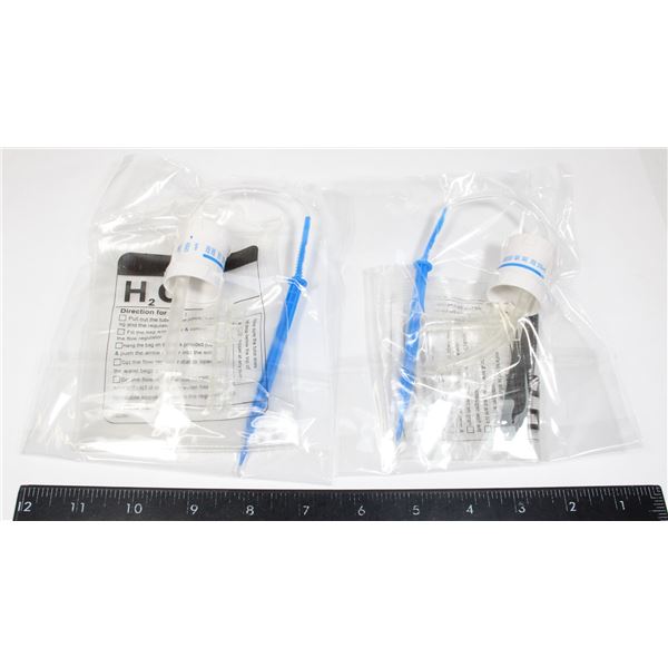 TWO UNUSED WATER DRIPPERS. INSTRUCTIONS ON BAG