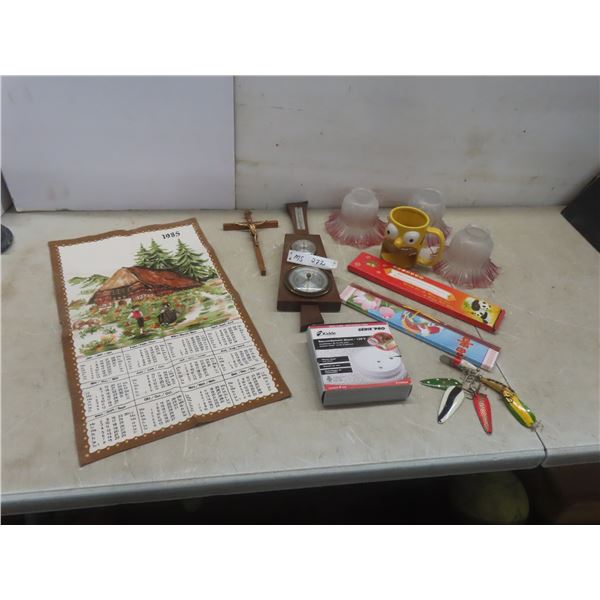 Cloth 1985 Calendar, Barometer, Crucifix, 3 Lamp Shades, Homer Simpson Cup, Fishing Lures, and More