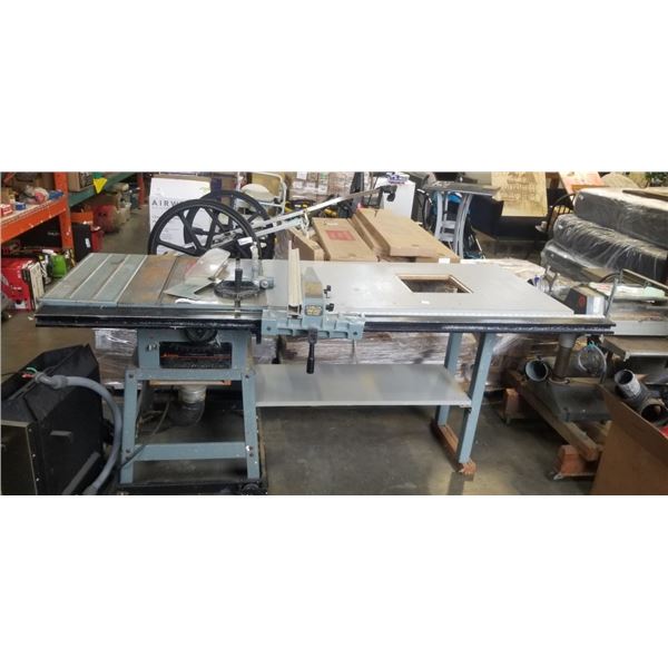DELTA 10 INCH CONTRACTOR TABLE SAW WITH CUSRTOM BUILT EXTENSION AND GUIDE RAIL ATTACHED, WORKING
