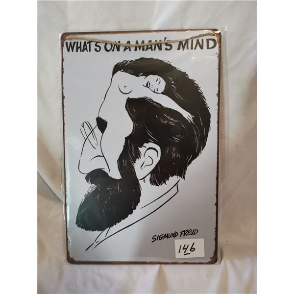 “What’s on a Man’s Mind” Tin Sign, 12x8”