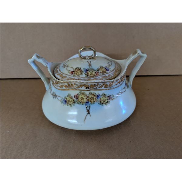 Old decorative 2 handle covered bowl. Good condition.