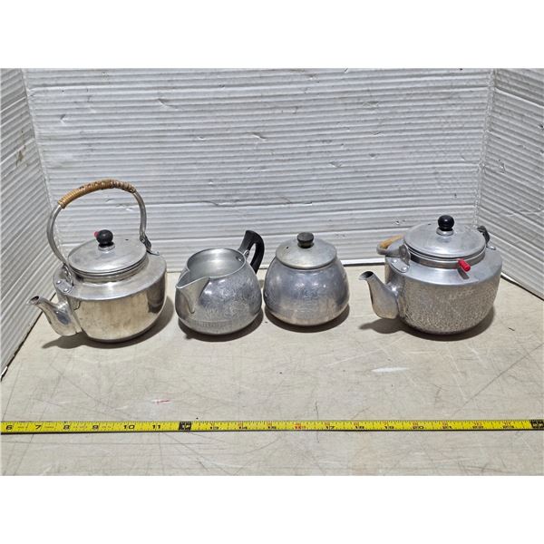 2 aluminum tea pots and cream with sugar