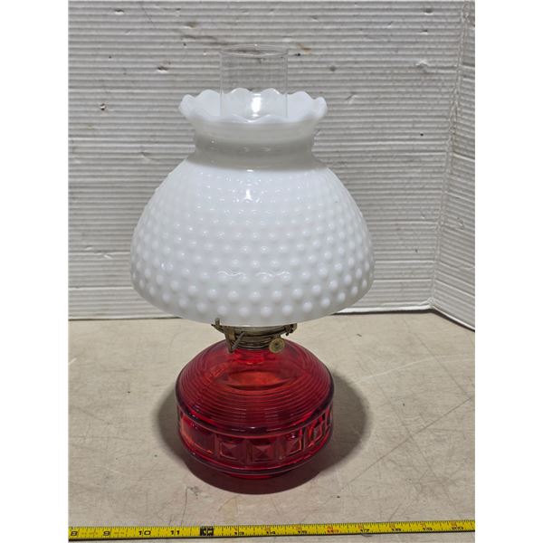 Red glass base oil lamp with chimney and shade