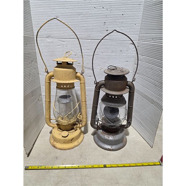 2 barn lanterns- 1 has a crack in the globe