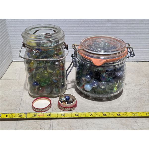 2 jars of marbles and some mini marbles