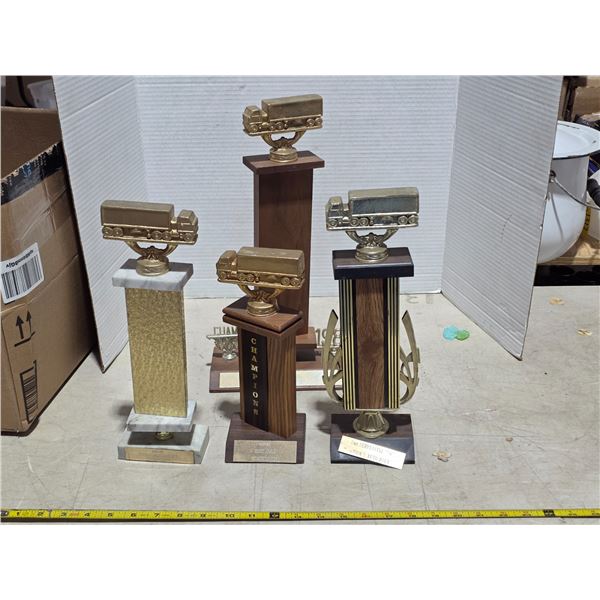 4 trucker trophies