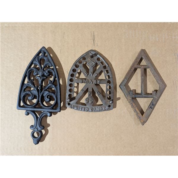 (3) Vintage Trivets w/ Markings (1) Cast Iron
