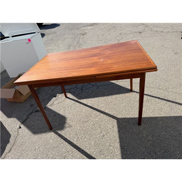Teak table with pullout leaves measures 4' x 32" with leafs in