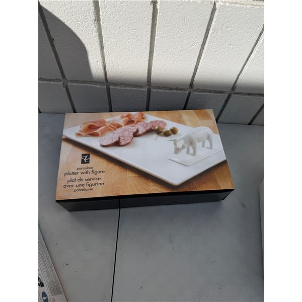 Porcelain platter with figurine
