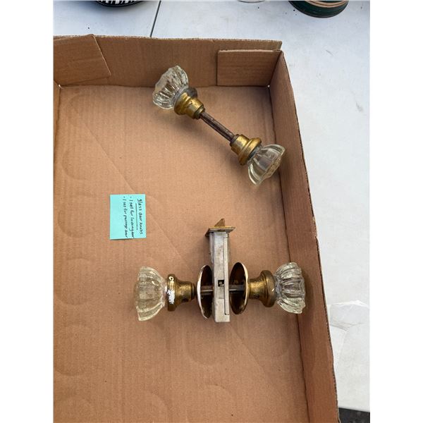 Glass door knobs, one set for locking door and one set for passage door