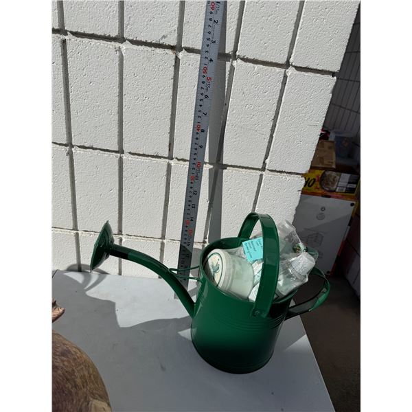 Watering can and assorted body soaps and lotions, etc.