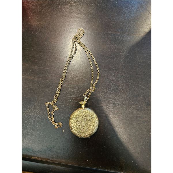 Locket with mirror on long chain