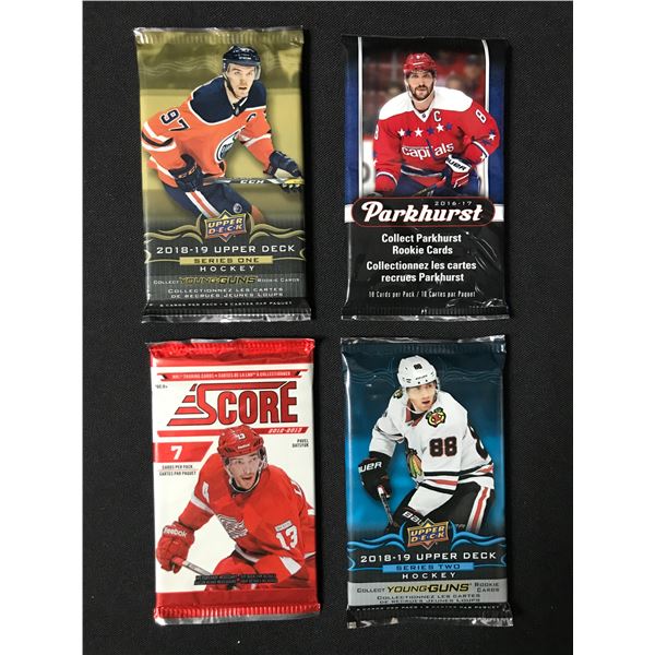 LOT OF 4 SEALED NHL HOCKEY CARD PACKS (VARIOUS YEARS)