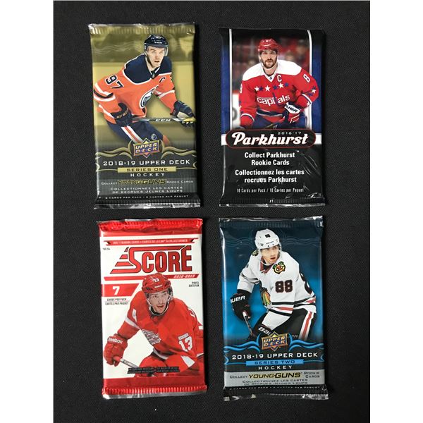 LOT OF 4 SEALED NHL HOCKEY CARD PACKS (VARIOUS YEARS)