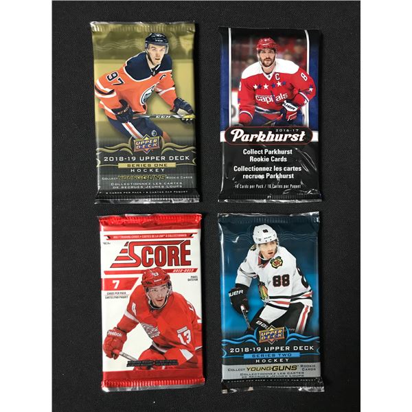 LOT OF 4 SEALED NHL HOCKEY CARD PACKS (VARIOUS YEARS)