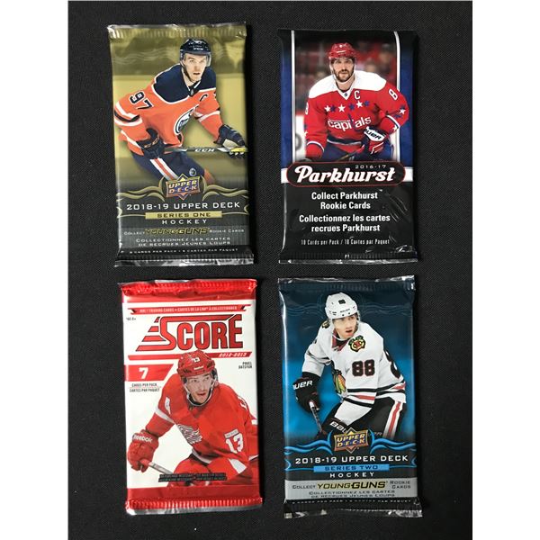 LOT OF 4 SEALED NHL HOCKEY CARD PACKS (VARIOUS YEARS)