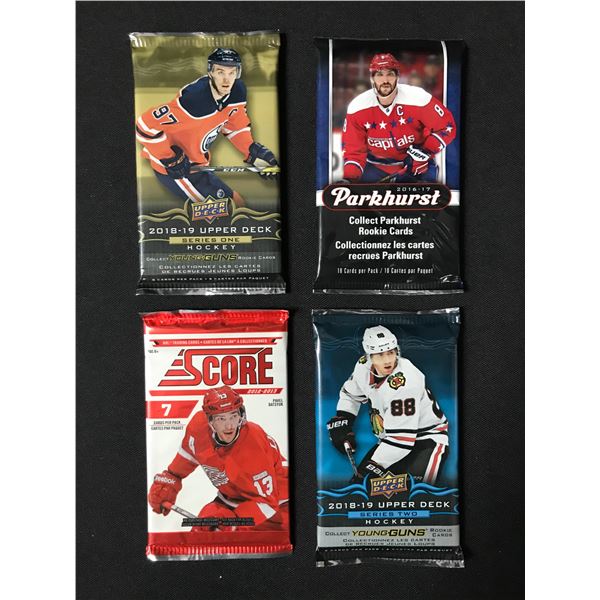 LOT OF 4 SEALED NHL HOCKEY CARD PACKS (VARIOUS YEARS)