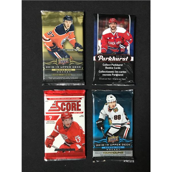 LOT OF 4 SEALED NHL HOCKEY CARD PACKS (VARIOUS YEARS)