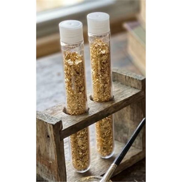Two Clear Plastic Tubes Containing Metallic Gold-Colored Particles