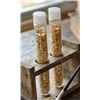 Image 1 : Two Clear Plastic Tubes Containing Metallic Gold-Colored Particles